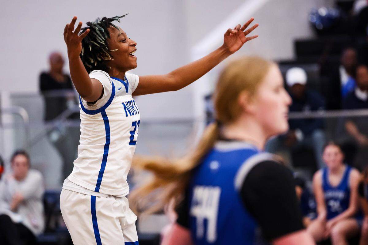 North Crowley forward Mecca Crawford holds out her hands after making a 3-pointer during a District 3-6A matchup against Weatherford on Friday at North Crowley.