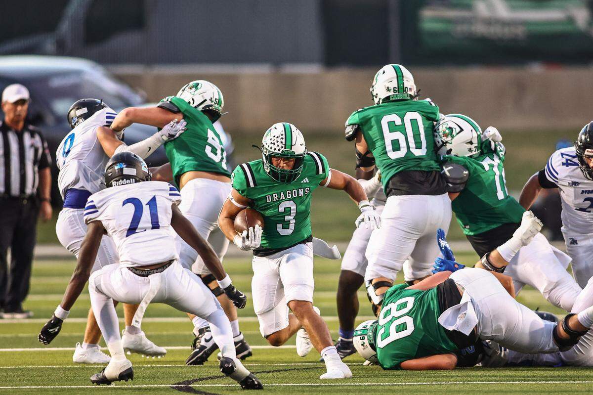 Southlake Carroll running back Davis Penn (3) runs against the Trophy Club Byron Nelson defense in a District 4-6A game on Friday, September 13, 2024 at Dragon Stadium in Southlake, Texas.