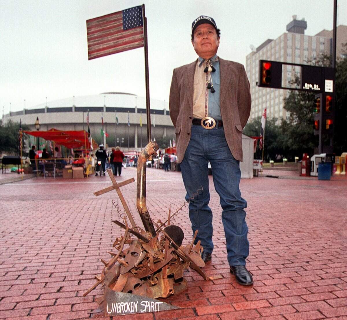 Nov. 11, 2001: The Viva Mexico Festival, a two city Mexican Independence Day event, was canceled after the 9/11 attack but returns two months later to honor Hispanic Veterans and Medal of Honor recipients. Sculptor Efrain Gutierrez of Fort Worth poses with a sculpture he calls ‘unbroken spirit’ after the events of 9/11.