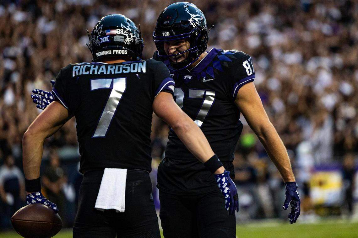 TCU wide receiver JP Richardson (7) celebrates with his teammate Blake Nowell (87 after scoring a touchdown in the first quarter of a Big XII conference game between the TCU Horned Frogs and the West Virginia Mountaineers at Amon G. Carter Stadium in Fort Worth on Saturday, Sept. 30, 2023.