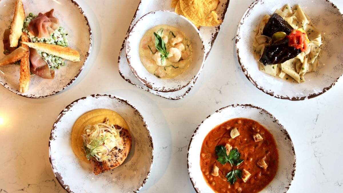 Stephan Pyles’ Fireside specials include (clockwise from top left) pea salad, shrimp ceviche, a braised chipotle short rib, gazpacho and grilled salmon on butternut squash-mascarpone polenta.