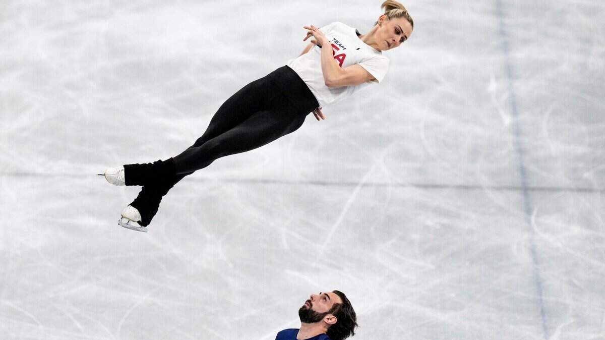U.S. figure skaters Ashley Cain-Gribble and Thimothy Leduc, who train in Euless, practice last week at Capital Indoor Stadium at the 2022 Winter Olympics in Beijing. (AP Photo/Bernat Armangue)