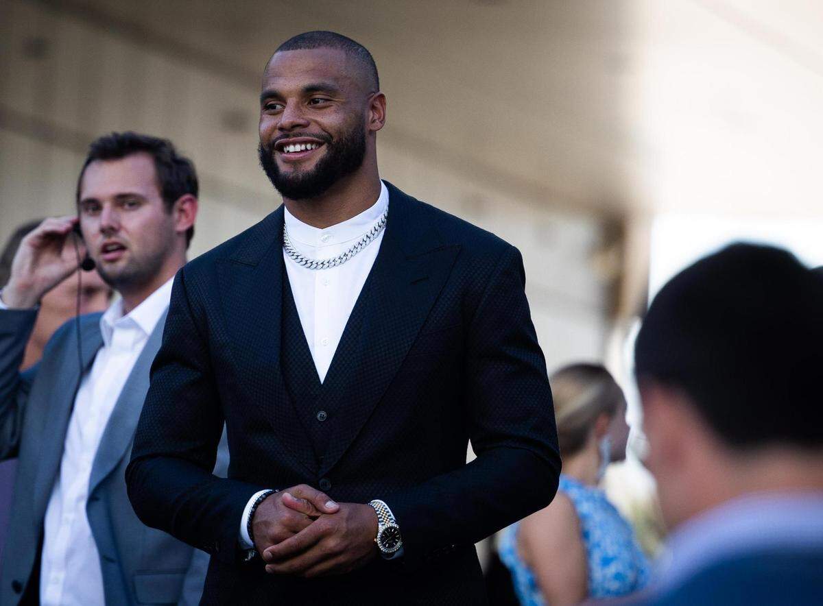 Dallas Cowboys Dak Prescott walks down the blue carpet for the season kickoff event Thursday, Aug. 25, 2022, at Ford Center in Frisco.