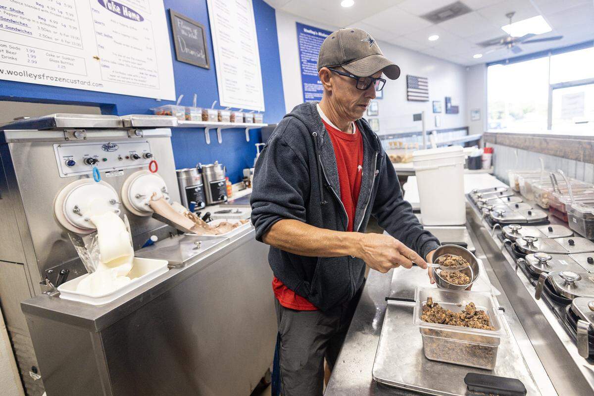 Co-owner Brett Allen, rear, makes a peanut butter concrete frozen custard in the morning for service at Woolley's Frozen Custard in Keller on Wednesday, Sept. 10, 2025. Woolley's was voted as the Best Ice Cream in Fort Worth by Star-Telegram readers.