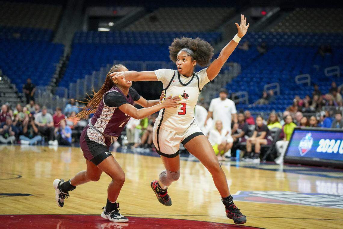 Frisco Liberty’s Jacy Abii, the Championship Game MVP, looks for a pass as she gets around Mansfield Timberview’s Kamryn Wilson in the Class 5A state championship game on Saturday, March 2, 2024 at the Alamodome in San Antonio, Texas. Liberty defeated Timberview 60-51.