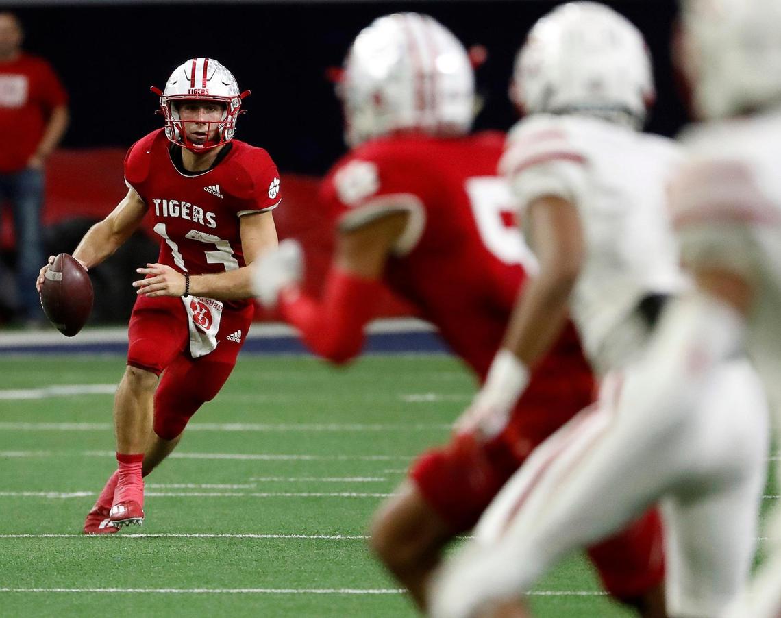 Glen Rose quarterback Hudson White (13) scrambles out of the pocket in the first half of a UIL Class 4A D2 state semifinal football game at the Ford Center in Frisco, Texas, Friday, Dec. 09, 2022. Carthage led Glen Rose 21-14 at the half (Special to the Star-Telegram Bob Booth)