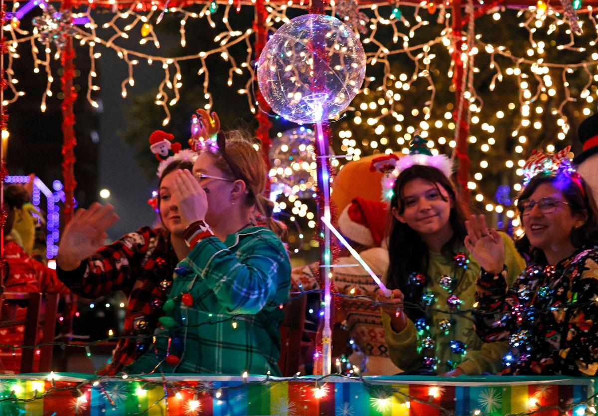 The International Order of the Rainbow for Girls passes down Commerce Street.