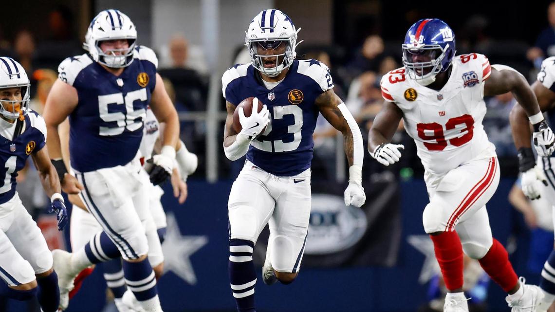 Dallas Cowboys running back Rico Dowdle runs the ball during the first quarter against the New York Giants on Thursday, Nov. 28, 2024, at AT&T Stadium in Arlington.