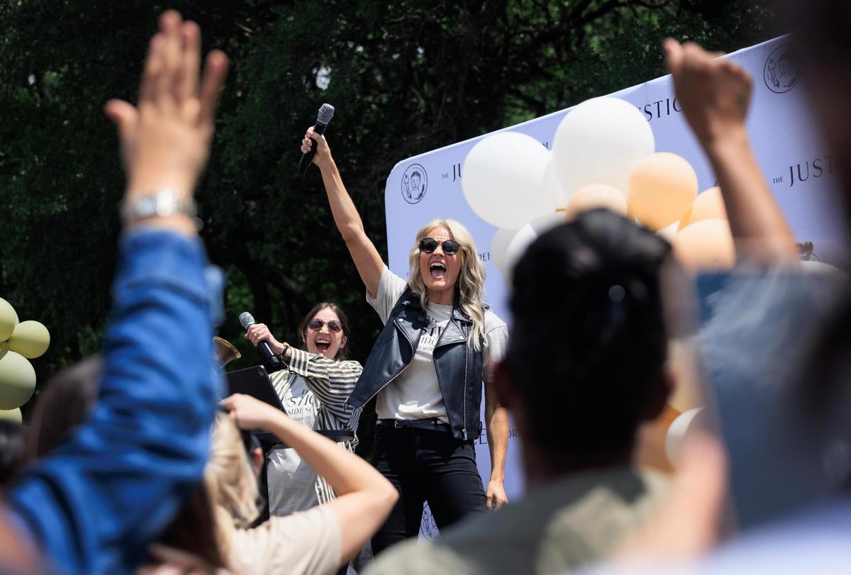 Mercy Culture Lead Pastor Heather Schott celebrates during the groundbreaking of the church’s Justice Residences on Friday, May 9, 2025, in Fort Worth. The groundbreaking comes after two years of Mercy Culture wrestling with the city of Fort Worth’s permitting process, and navigating disagreements with nearby residents.