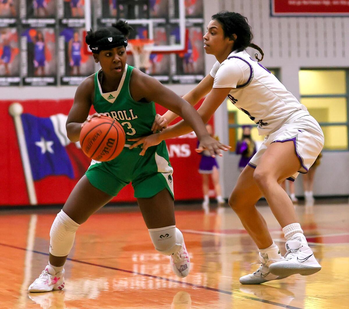 Southlake Carroll forward Jordyn Sowell (L) looks to get past Keller Timber Creek forward Maya Linton (R) during the second half of a 6A Region I Regional Quarter-Finals Girls Basketball playoff game played on Thursday, February 25, 2021 at Justin Northwest High School. (Steve Nurenberg Special to the Star-Telegram)