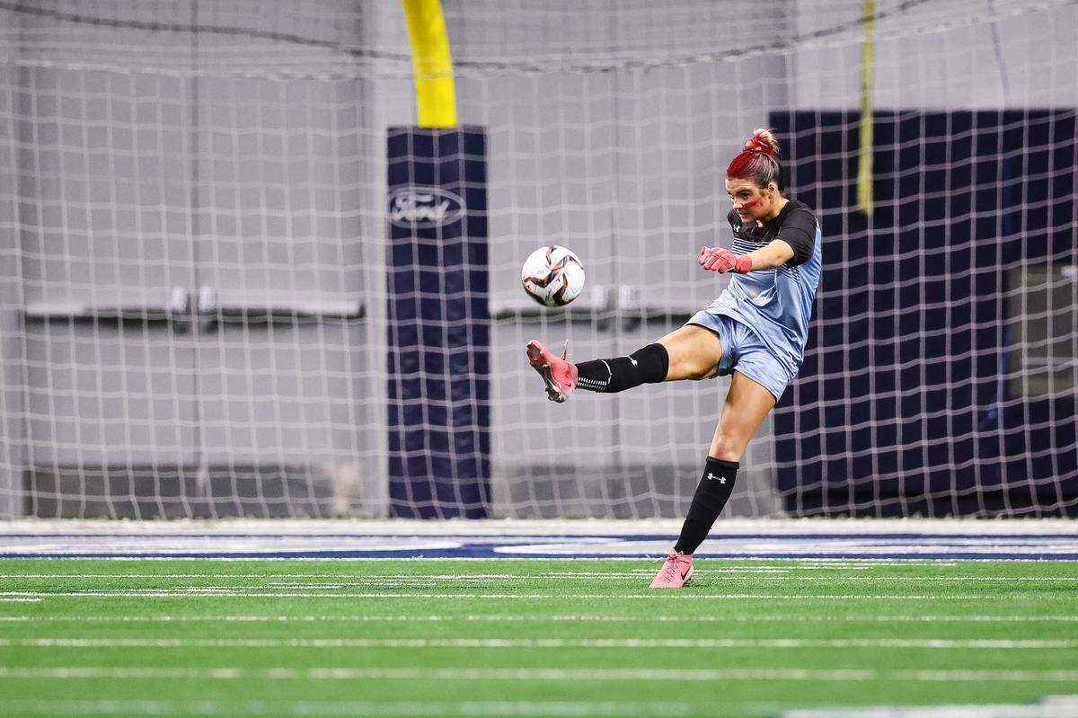 Grapevine goalkeeper Brooke Bereuter (1) punts the ball after making a save against Frisco Wakeland in a Class 5A Division II UIL girls soccer state semifinal at the Ford Center on April 3, 2026 in Frisco, Texas.