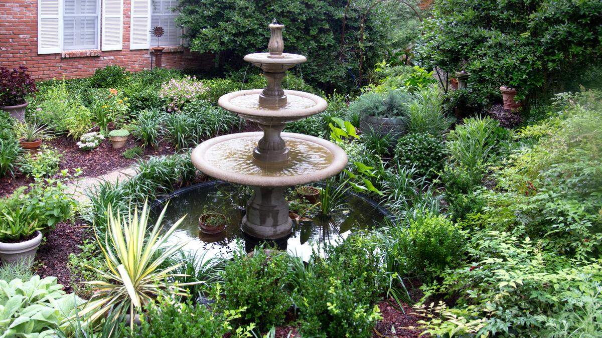 A fountain and garden have replaced what used to a lawn in the Sperry yard.