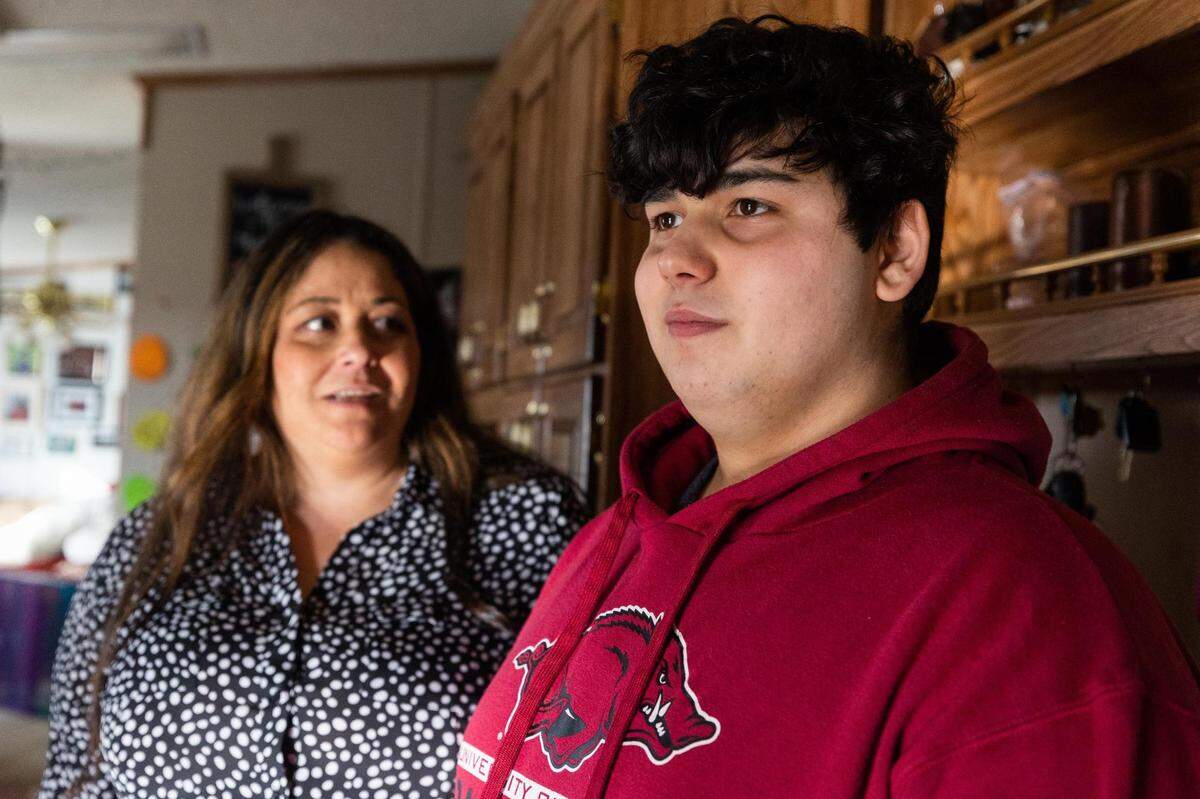 Angelita Hunter, left, chats with her son Aden Stasney, 15, who is on the autism spectrum, in their kitchen Feb. 22, 2022, in Van Alstyne. Staff at Aden’s school often deviated from his Individualized Education Plan, Hunter said, and a pattern of escalation led to the 15-year-old facing criminal charges after a scuffle with a teacher’s aide.