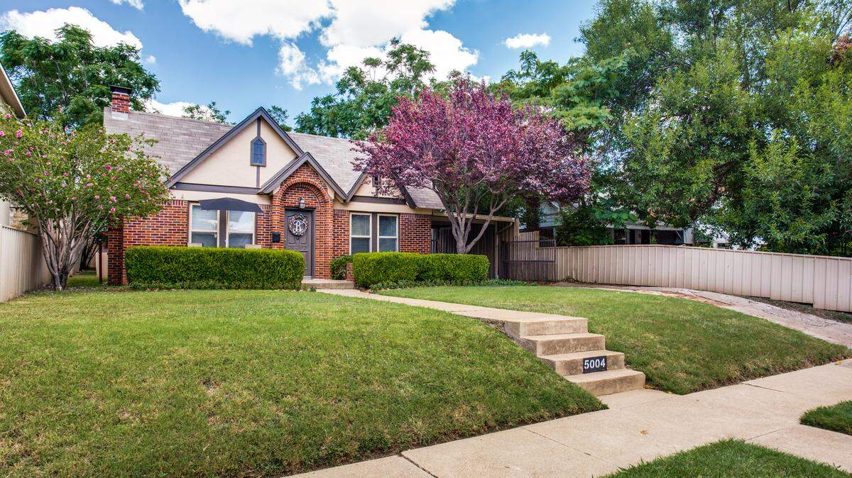 The home at 5004 Pershing Avenue features original hardwood floors and many updates. 