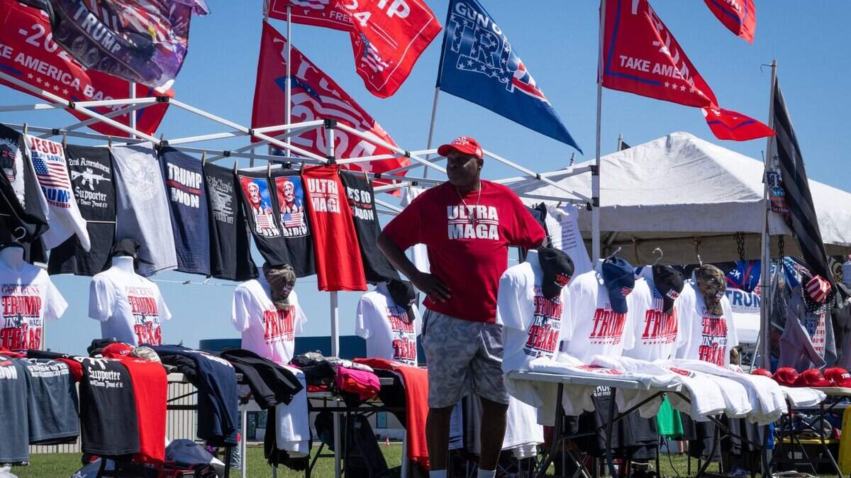Zachary Hopkins, from North Carolina, runs his BewareTees shop outside of Donald Trump’s Make America Great Again Rally in Waco.
