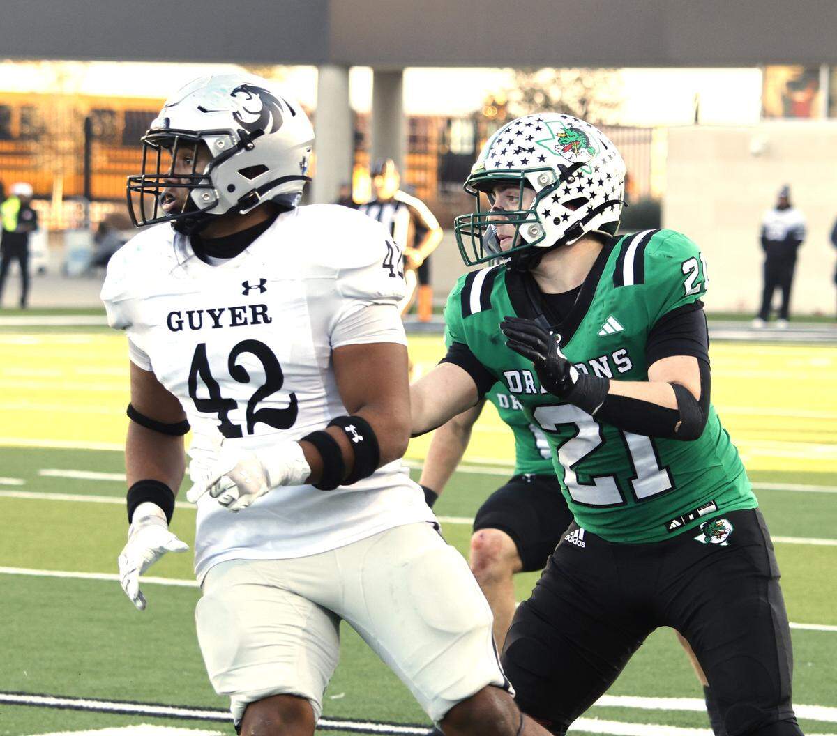 Southlake Carroll linebacker Robbie Ladd (21) defends against Denton Ryan tight end Grant May-Wright (42) during the second half of a UIL Class 6A Division II Quarterfinal on Saturday Dec. 06, 2025 at Crowley ISD Multi-Purpose Stadium in Fort Worth, Texas.