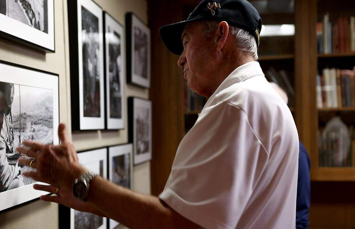 Vietnam War veteran Ray Bush looks at the photographs taken by Bob Schieffer at the public opening of the special collection of his work on Monday, Feb. 9, 2026, at UT Arlington.