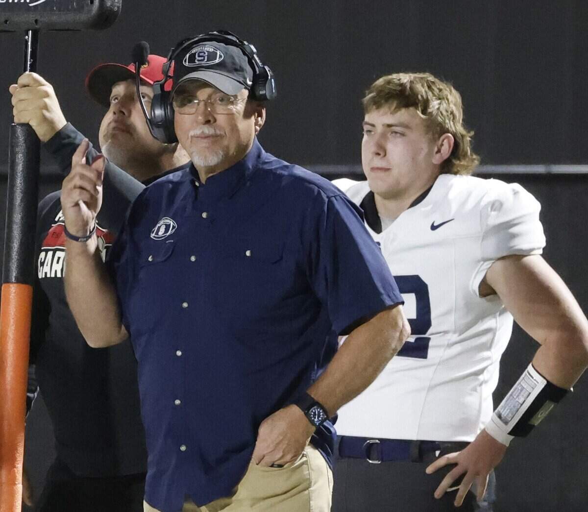 Fort Worth All Saints head coach Aaron Beck roams the sidelines during the first half of a TAPPS football game between Fort Worth All Saints and Fort Worth Christian at Barrow Field in North Richland Hills, Texas, Friday, October 31, 2025.