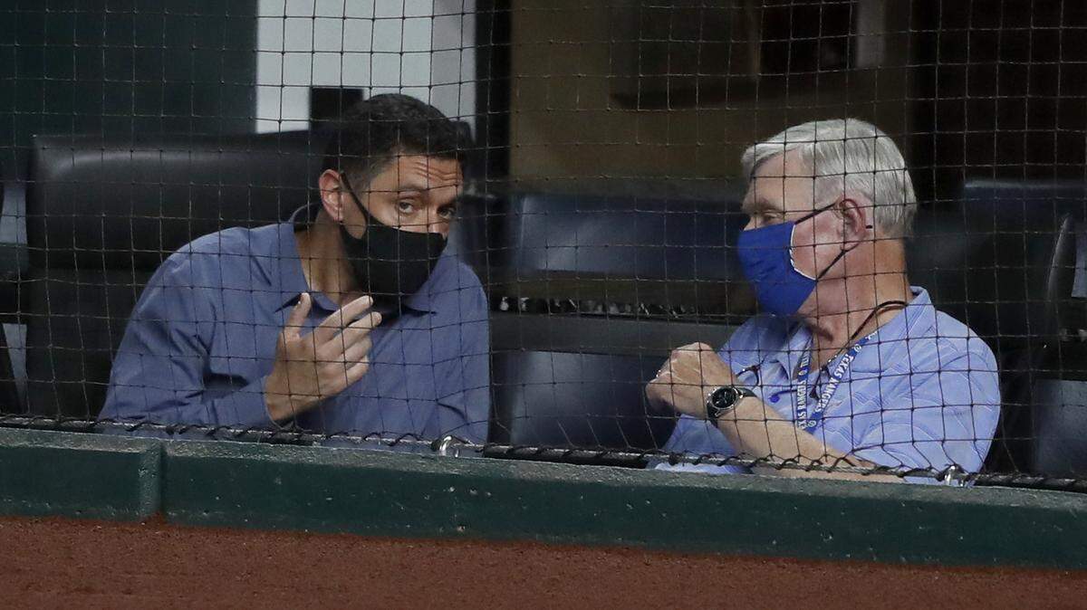 Texas Rangers general manager Jon Daniels, left, talks with team co-owner Ray Davis, during a game at Globe Life Field earlier this month.