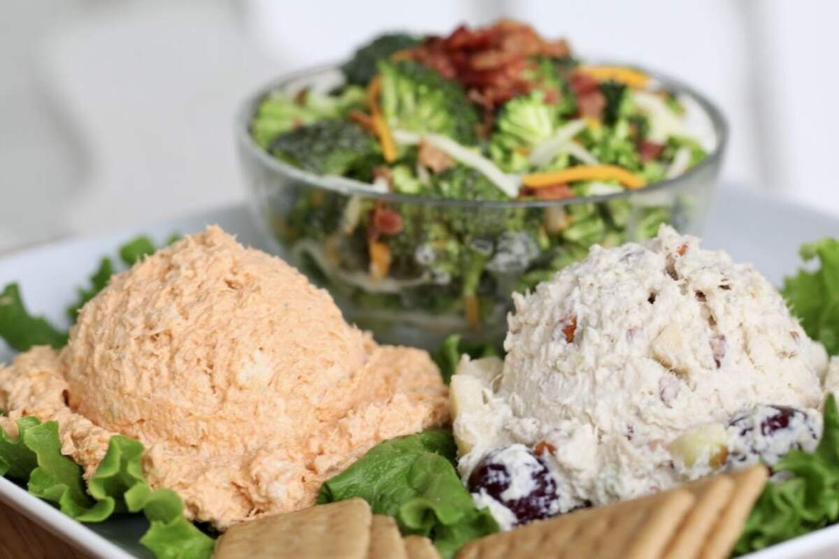 A “trio” comes with two different scoops of chicken, pimiento or egg salad plus a side green salad at Chicken Salad Chick.