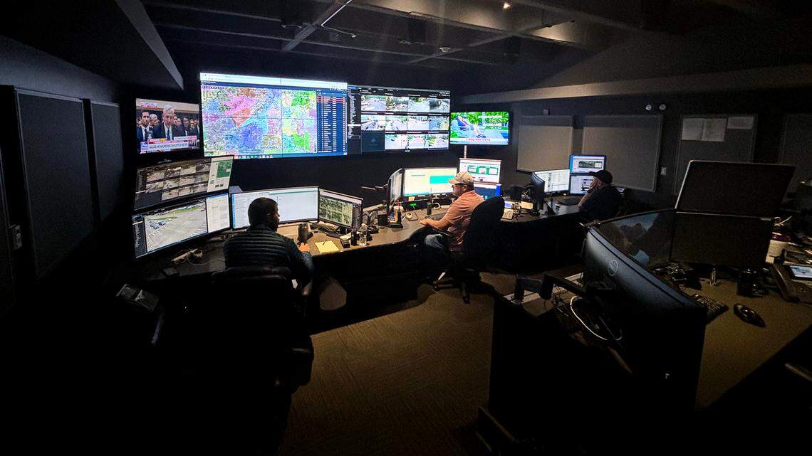 A photo of the Real Time Crime Center in Fort Worth, where three officers look at computer screens with intel collected from cameras and other tech across the city.