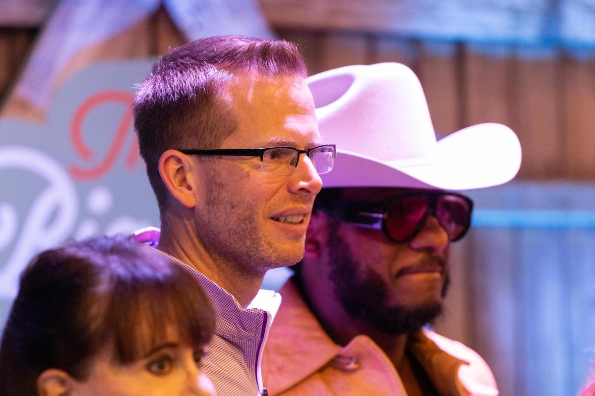 TCU Women’s basketball Head Coach Mark Campbell takes a photo with musician Leon Bridges during The Big Good’s annual fundraiser ‘The Big Night’ at the River Ranch Stockyards in Fort Worth on Thursday, April 3, 2025.