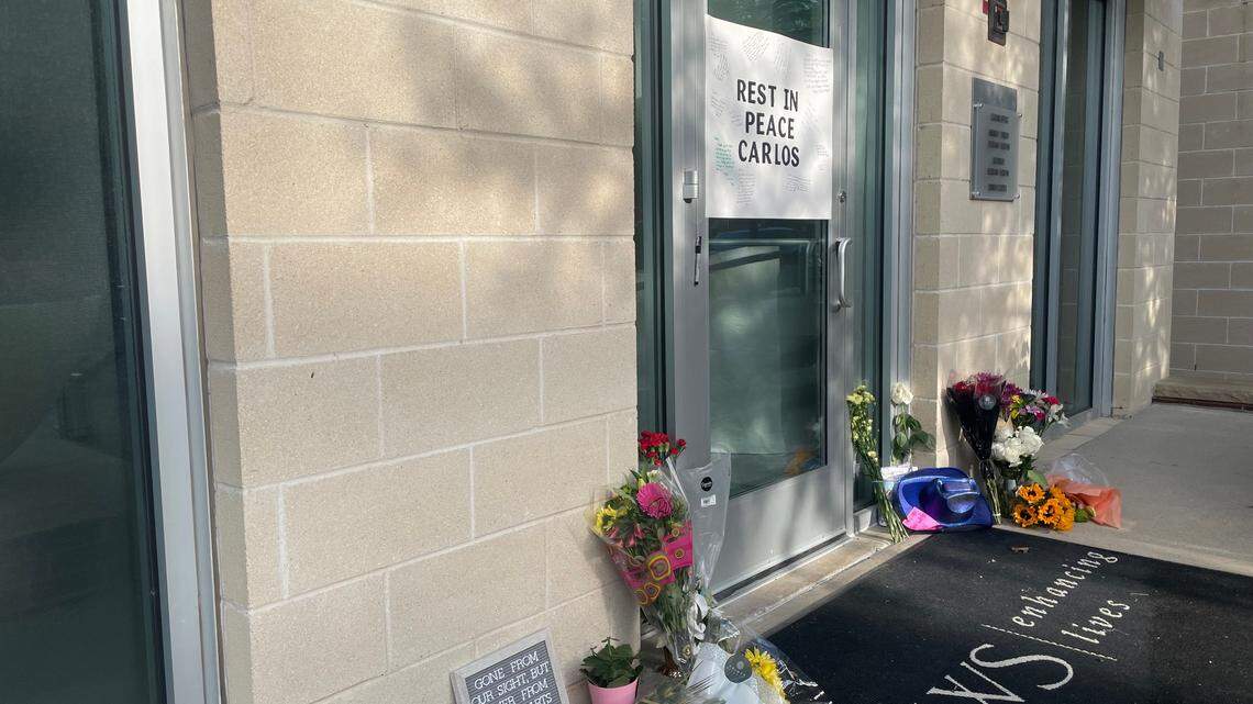 Residents at the Marq at West 7th apartments have created a small memorial in front of the property’s leasing office for Carlos Abaya, the maintenance employee shot and killed there Friday night.