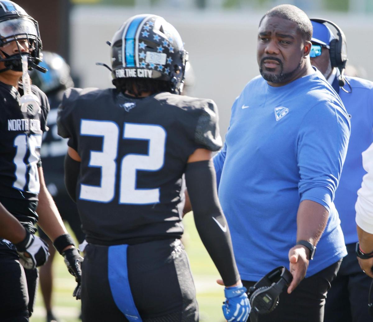 North Crowley head coach Ray Gates talks to linebacker Avery Dotson (32) during a UIL Class 6A D1 Bi-district playoff football game at Crowley ISD Multi-Purpose Stadium in Fort Worth, Texas, Saturday, Nov. 16, 2024.