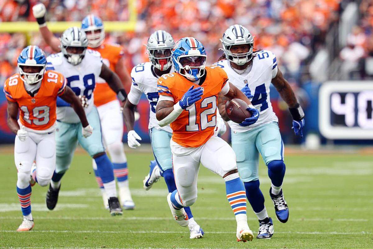 DENVER, COLORADO - OCTOBER 26: RJ Harvey #12 of the Denver Broncos runs the ball against the Dallas Cowboys during the first quarter in the game at Empower Field At Mile High on October 26, 2025 in Denver, Colorado. (Photo by Jamie Schwaberow/Getty Images)