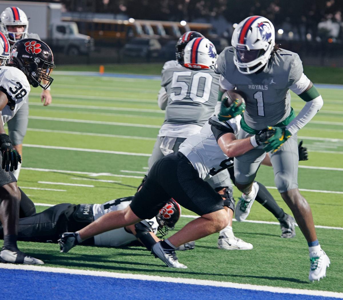 Richland running back Mike Turner (1) crosses the goal line for six defended by Colleyville linebacker Madden Williams (9) during a UIL football game at Birdville Fine Arts and Activity Center in North Richland Hills Friday, Sept. 6, 2024.