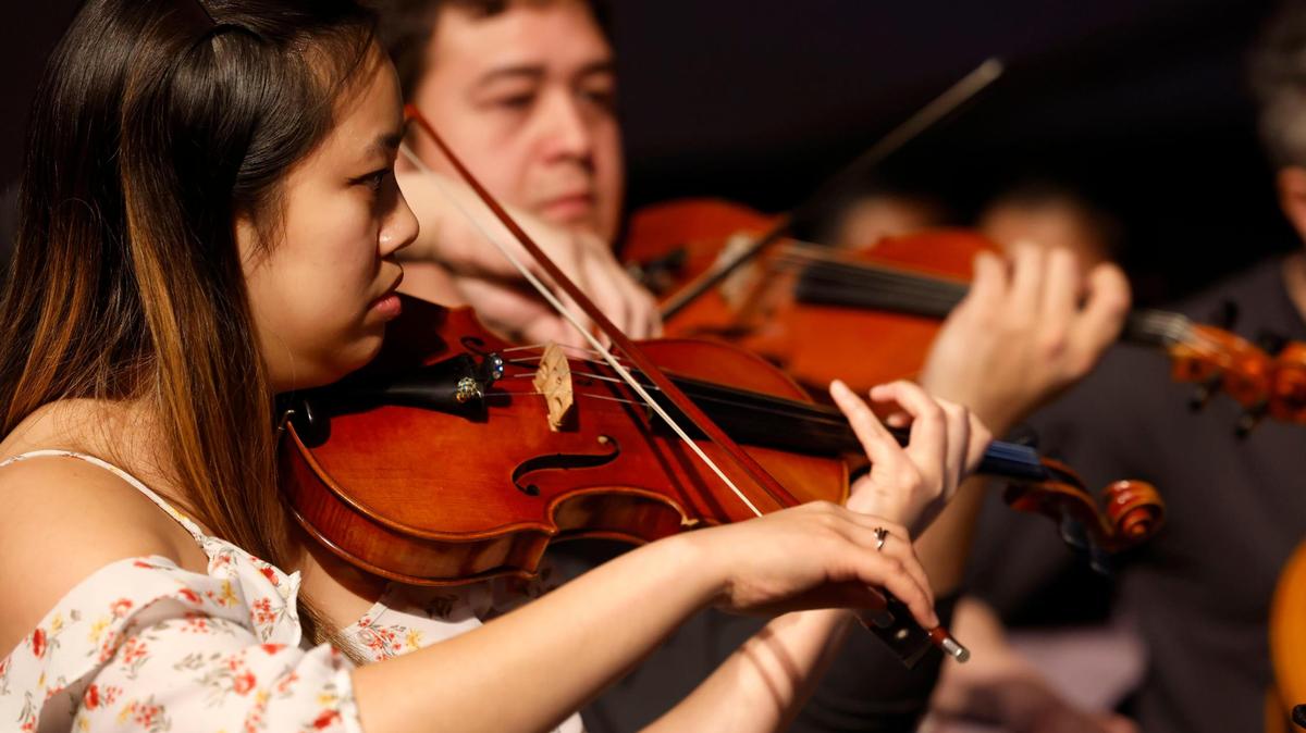 Thao Pham, one of the founders of the Mansfield Philharmonic, rehearses with the ensemble for an upcoming performance on Thursday, Nov. 21, 2024, at First Methodist Mansfield. Mansfield Philharmonic is a volunteer string ensemble.