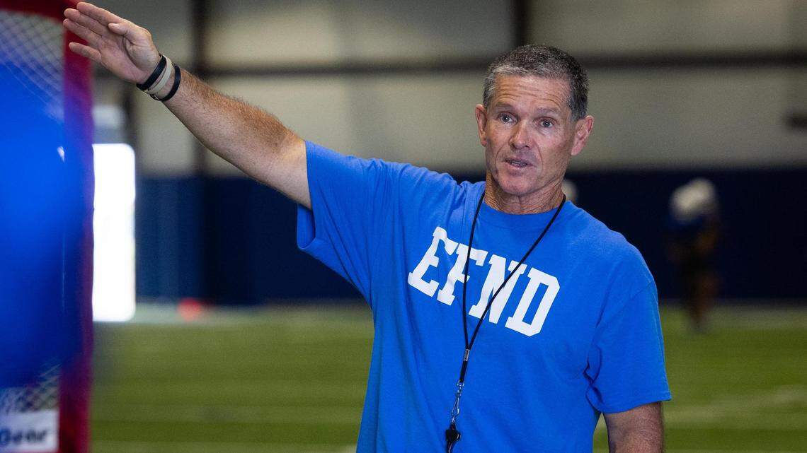 Decatur head coach Steven Huff talks to players during practice Monday, Aug. 22, 2022, at Decatur High School.