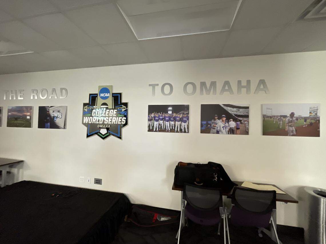 A wall with the words "Road to Omaha" and photos of TCU's baseball teams that have gone to the College World Series.