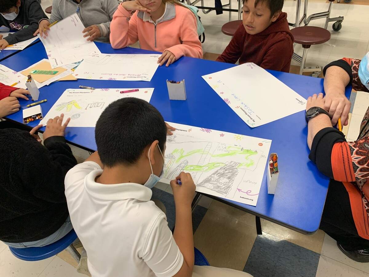 Students at W.J. Turner Elementary School draw their dream playground designs, which will be turned into an actual playground over the summer.