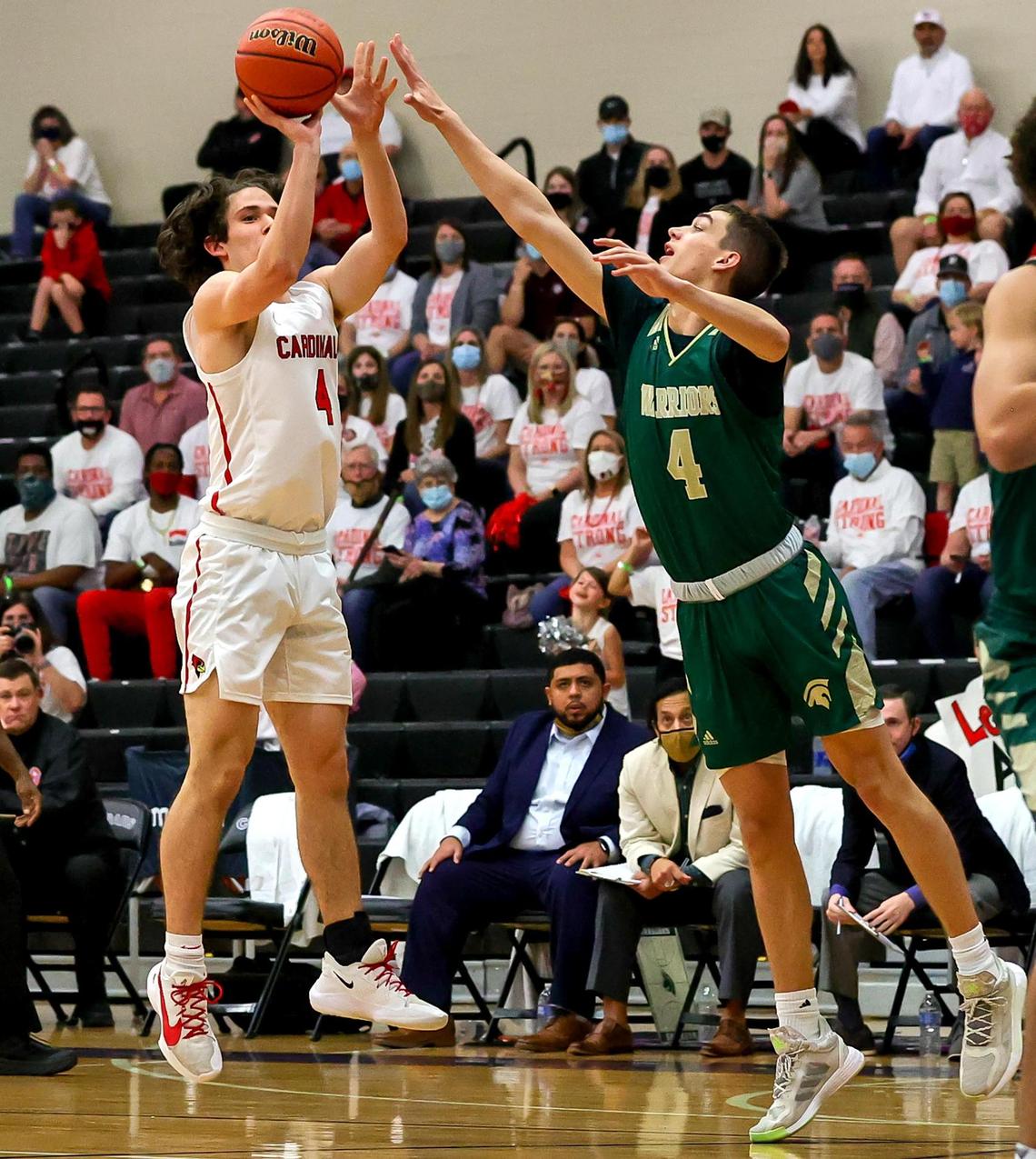 Fort Worth Christian guard Nathan Bledsoe (4) tries to shoot over The Woodlands Christian Academy guard Wyatt Boeker (R) uring the first half of the 5A TAPPS Boys Basketball State Championship game played on March 12, 2021 at College Station High School in College Station, TX. (Steve Nurenberg Special to the Star-Telegram)