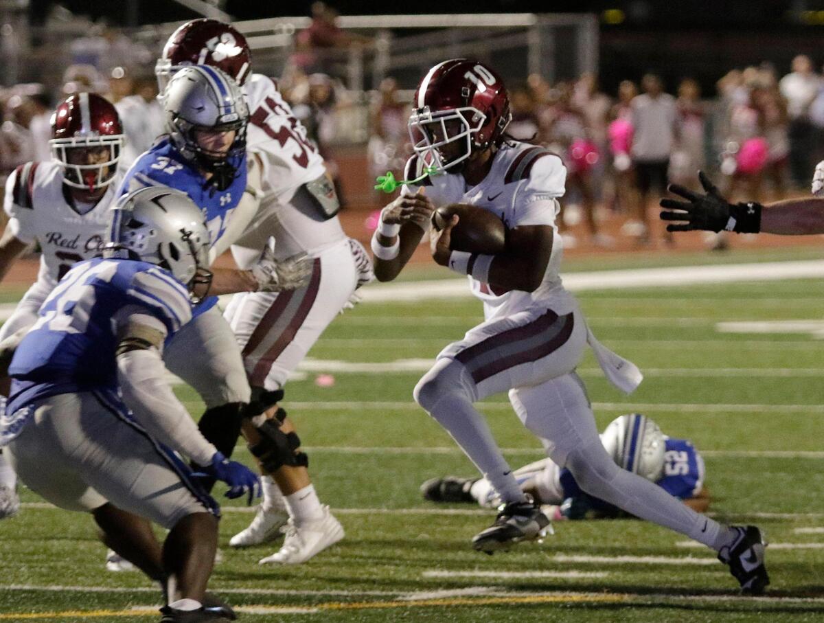 Red Oak’s Billy Middleton find a hole in Burleson’s defense during a UIL football game at Burleson ISD Stadium on Friday October 25, 2024.