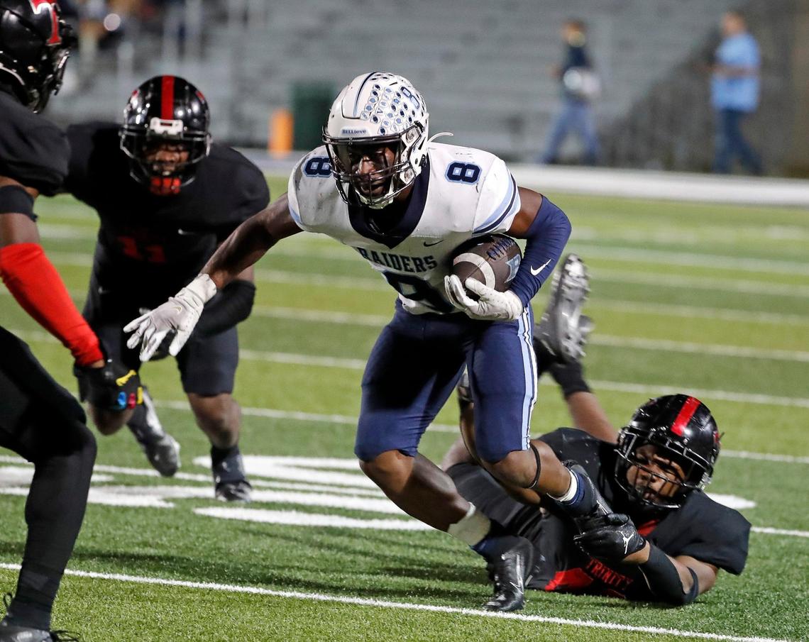 L.D. Bell running back Gracien Anto (8) is brought down by the shoe strings after a short gain in the second half of a District 3-6A high school football game at Pennington Field in Bedford, Texas, Thursday, Nov. 03, 2022. Trinity defeated L.D. Bell 27-24 in overtime for the 25th year in a row. (Special to the Star-Telegram Bob Booth)
