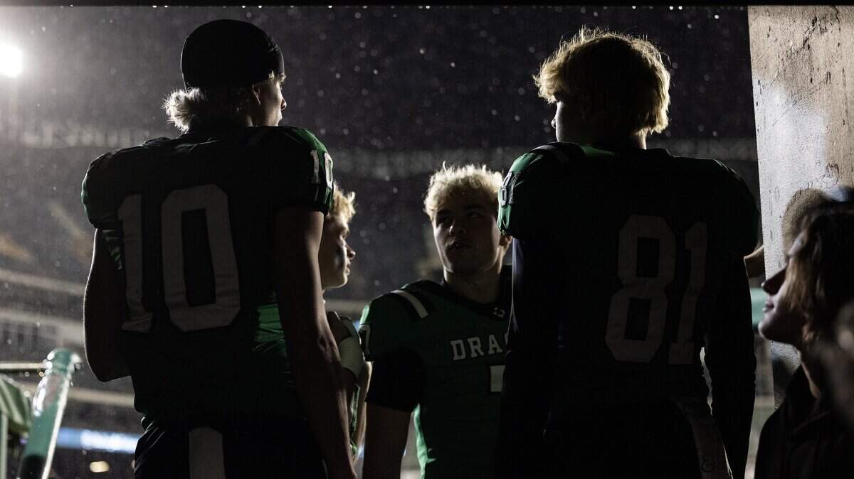 Southlake Carroll players Brody Knowles (10), Dalton Tade (81), Luke Bussman (7), and Taevin Kunz (11) comes out of the locker room during a weather delay during the UIL Division II Regional playoff game at Choctaw Stadium in Arlington on Friday, Nov. 28, 2025.