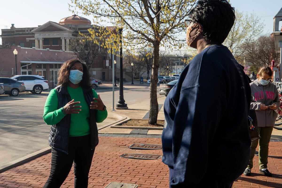 Fort Worth Councilwoman Kelly Allen Gray talks with people in line for the free pop-up clinic Saturday, March 20, 2021, at Evans Avenue Plaza in Fort Worth. The clinic was organized by Gray and Mercy Clinic to serve residents of the 76104 ZIP code.