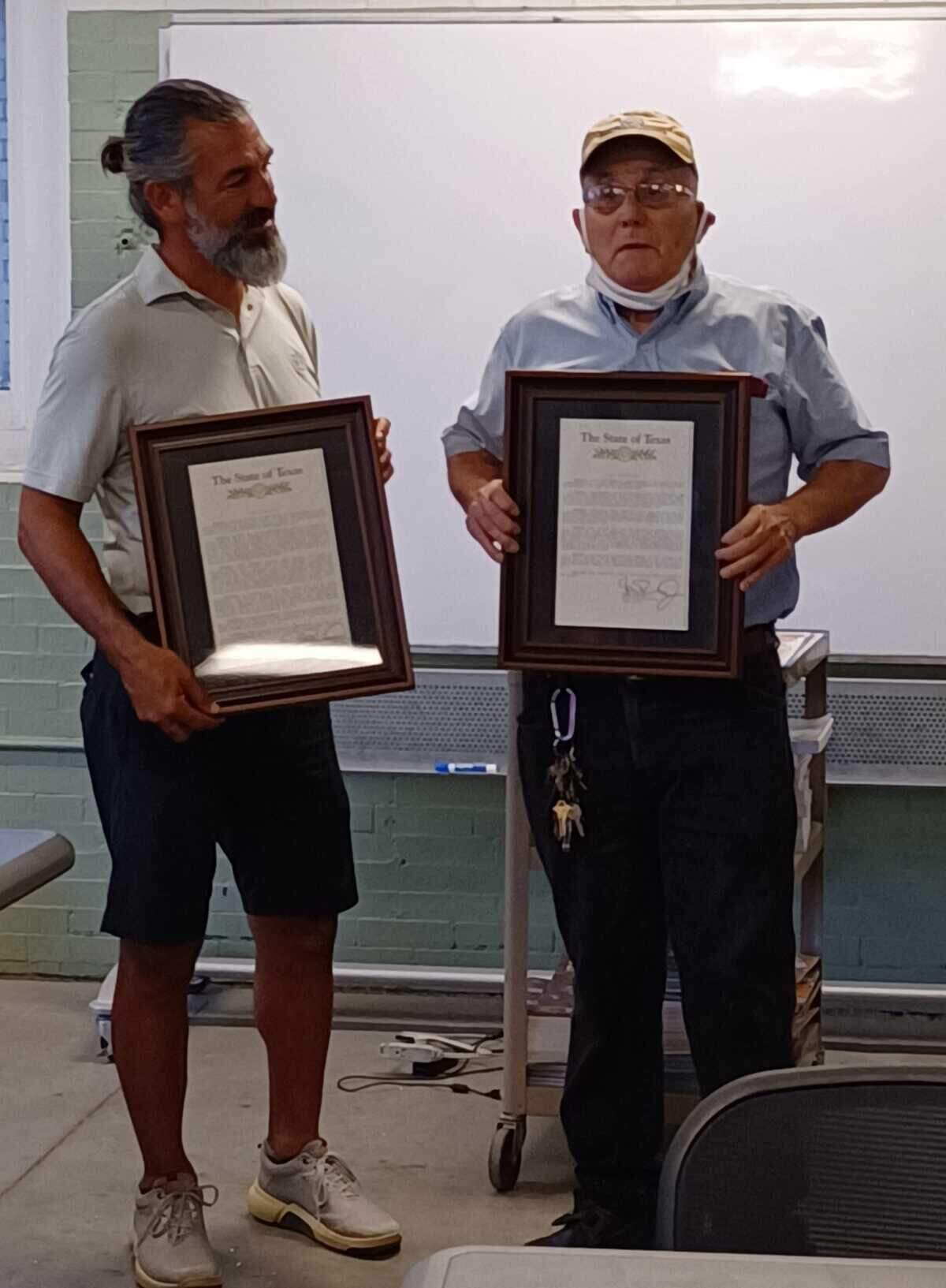 State Rep. Ramon Romero, left, presented two state resolutions on Aug. 30, 2022, at a South Hemphill Heights Neighborhood Association meeting in old Firehouse No. 10, honoring Fernando Florez, right, and his late wife Roberta Florez for their community contributions.