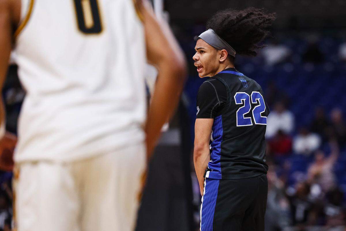North Crowley guard Isaak Hayes (22) screams in celebration after making a three pointer in the Class 6A Division I state championship against San Antonio Brennan at The Alamodome in San Antonio, Texas, March 14, 2026.