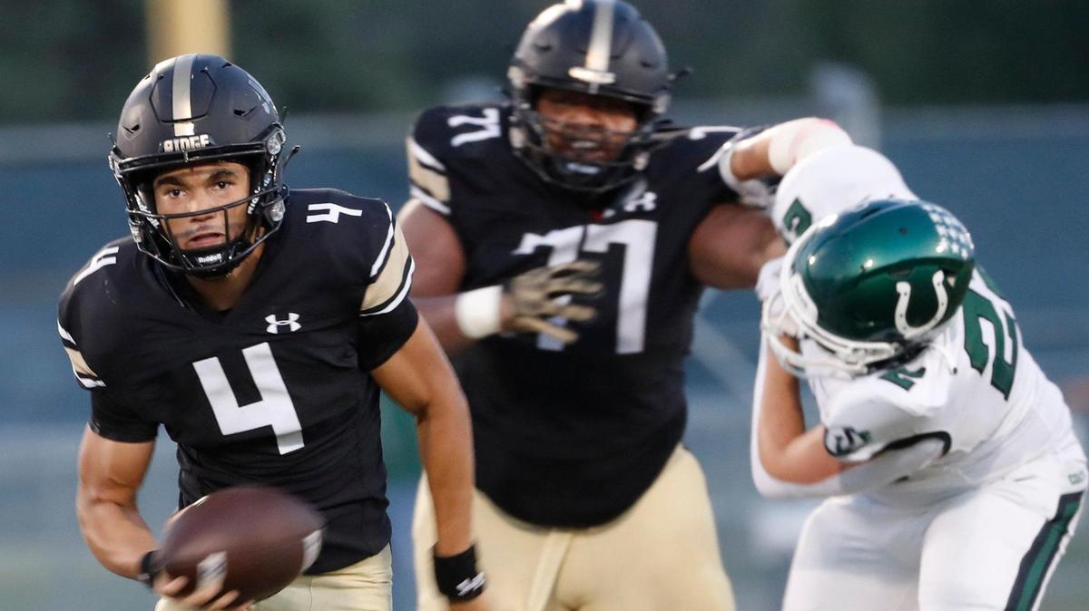 Fossil Ridge quarterback Logan Cundiff (4) takes off on a keeper in the first half of a high school football game at Keller ISD Stadium in Keller, Texas, Thursday, Sept. 08, 2022. Keller Fossil Ridge led 20-14 over Arlington High School at the half. (Special to the Star-Telegram Bob Booth)