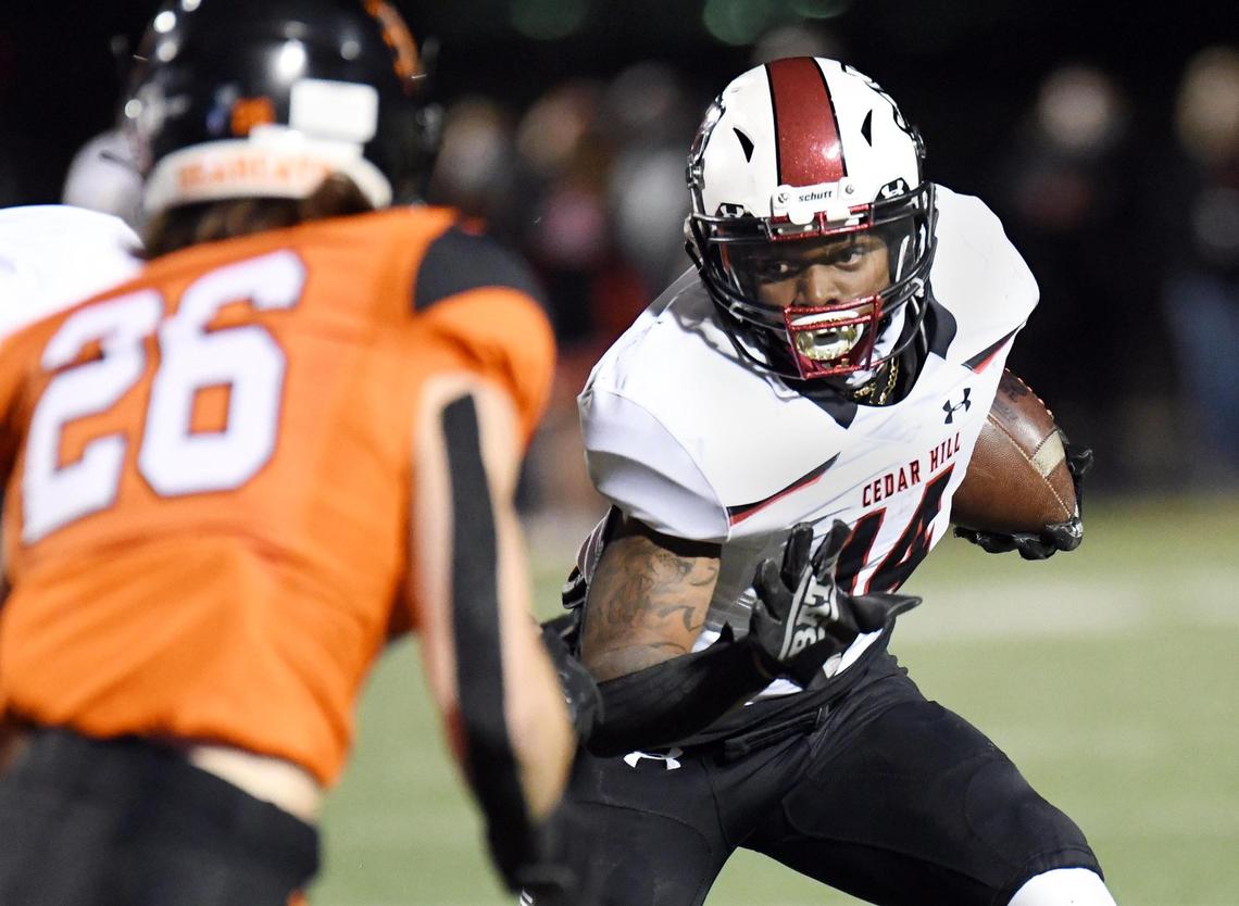 Cedar Hill’s Kylon Ashton, right, tries to get out of the backfield as Aledo’s Sammy Steffe comes up to make the stop in the second quarter of their football game Friday, October 16, 2020 at Bearcat Stadium in Aledo, Texas. Special/Bob Haynes