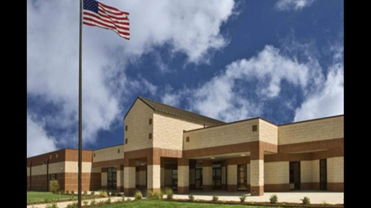 A Bowie High School coach was on administrative leave as authorities investigate an allegation that he assaulted a 14-year-old student in a gym.