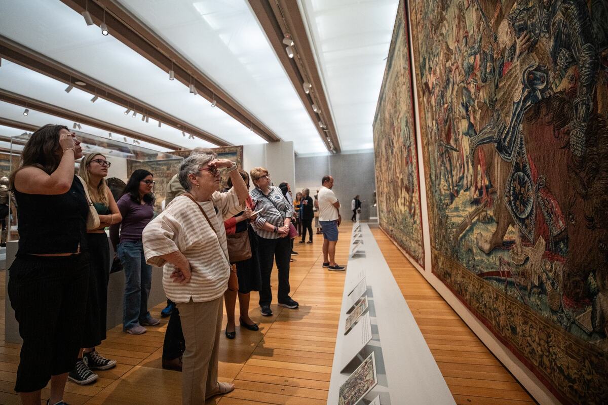 Guests gaze up at a tapestry of the ‘Art and War in the Renaissance: The Battle of Pavia Tapestries’ exhibit on Friday, June 14, 2024, at the Kimbell Art Museum. The tapestries commemorate Emperor Charles V’s decisive victory over French King Francis I that ended the sixteenth-century Italian Wars.