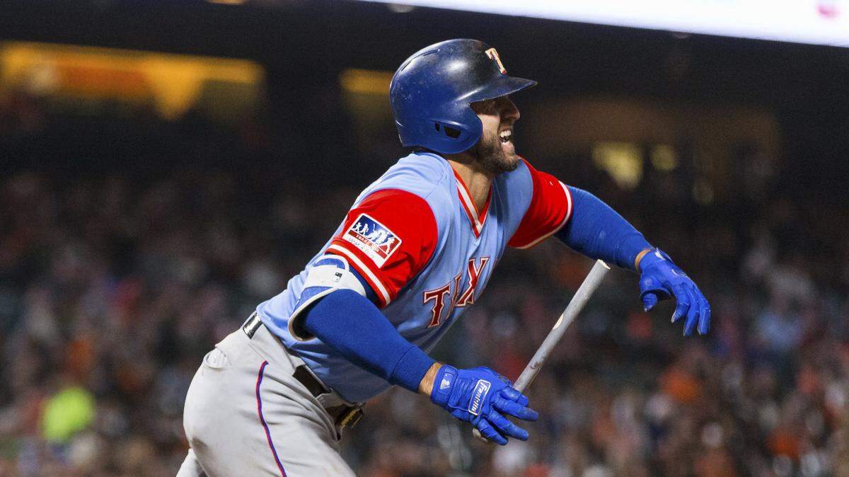 Joey Gallo grimaces exiting the batter’s box Friday in the eighth inning after twisting his left ankle while delivering an RBI single.