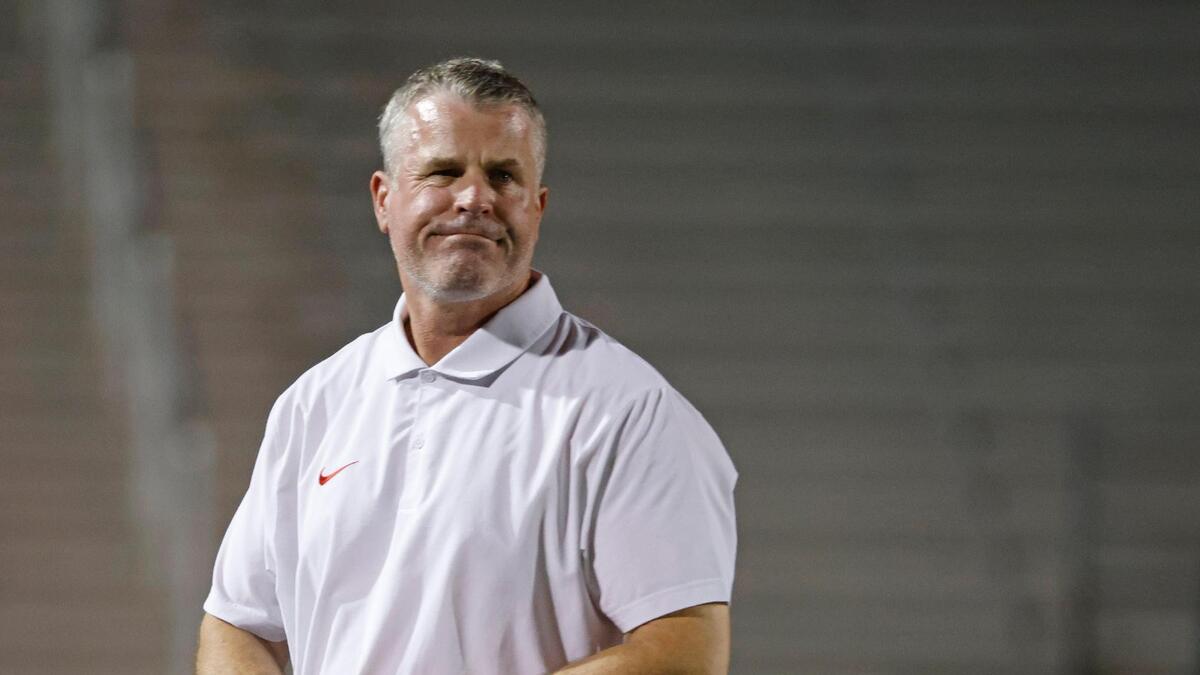 Trinity head coach Aaron Lineweaver and the Trojans defeated Justin Northwest.
