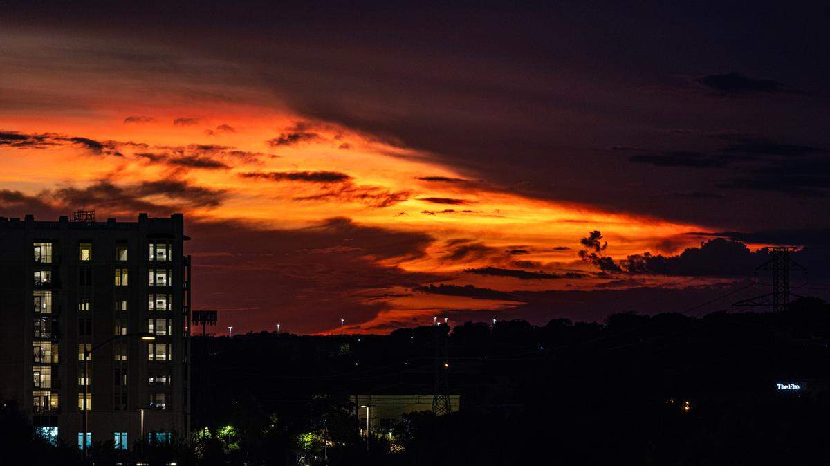 The sunset gets taken over by storm clouds at The Shop at Clearfork in Fort Worth on Wednesday, October. 4, 2023.