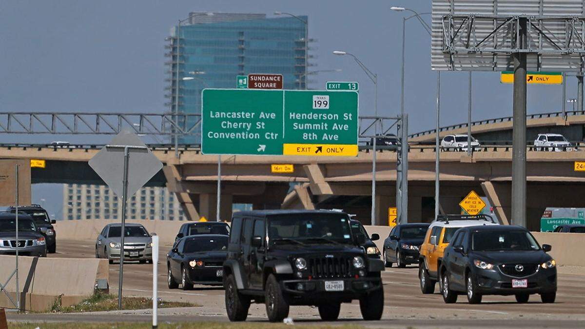 Westbound cars on I-30 near Forest Park. Texans tend to keep the pedal to the metal, driving fast on area highways and toll roads in Fort Worth.