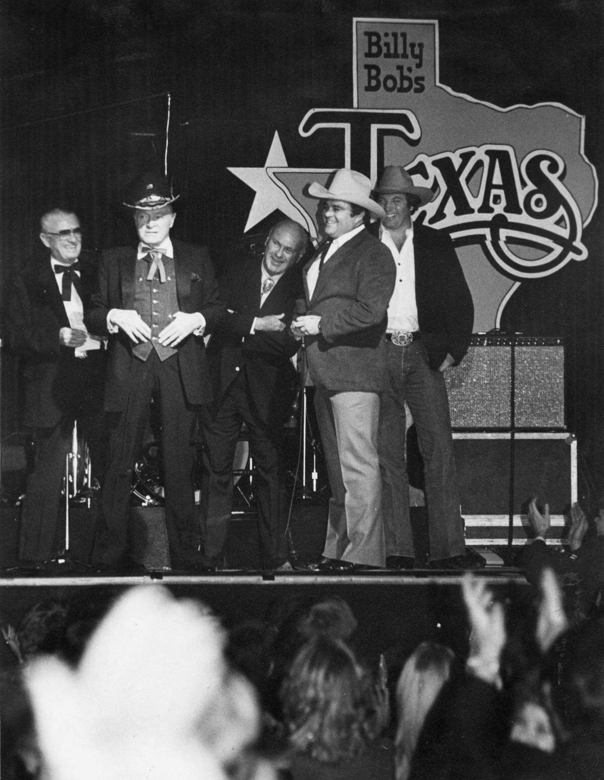 Jan. 2, 1982: Bob Hope strikes a pose after receiving a cowboy hat from the committee that brought him to Billy Bob’s north side club for New Years Eve. Among those making the presentation were Amon Carter Jr., right of Hope, and owner Billy Bob Barnett, far right.